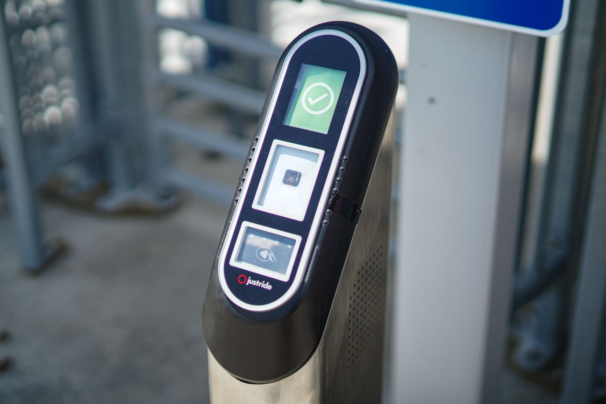 A fare validator outside of a security gate.